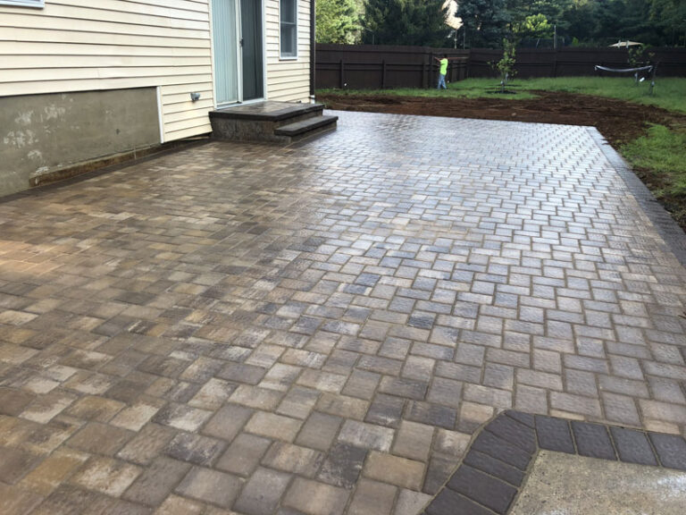 Herringbone paver patio with a contrasting curved edge border