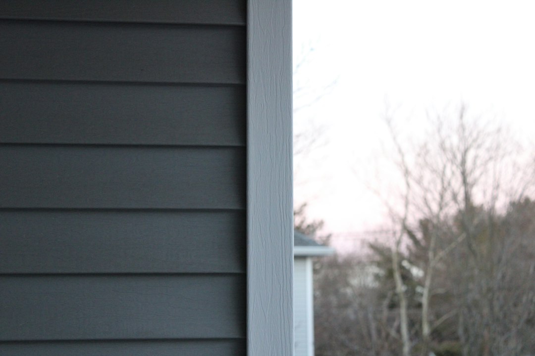 Horizontal siding meeting white exterior trim