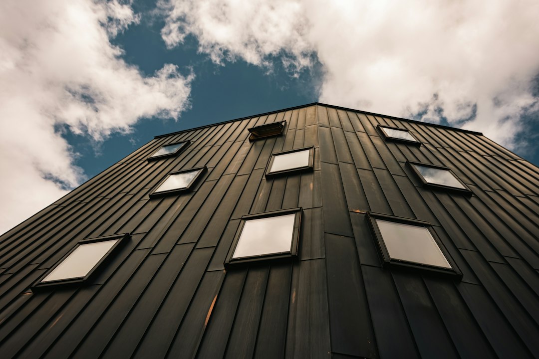 Glass skylights and flashing on a sloped metal roof